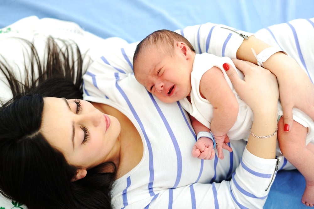 Happy mother with newborn baby